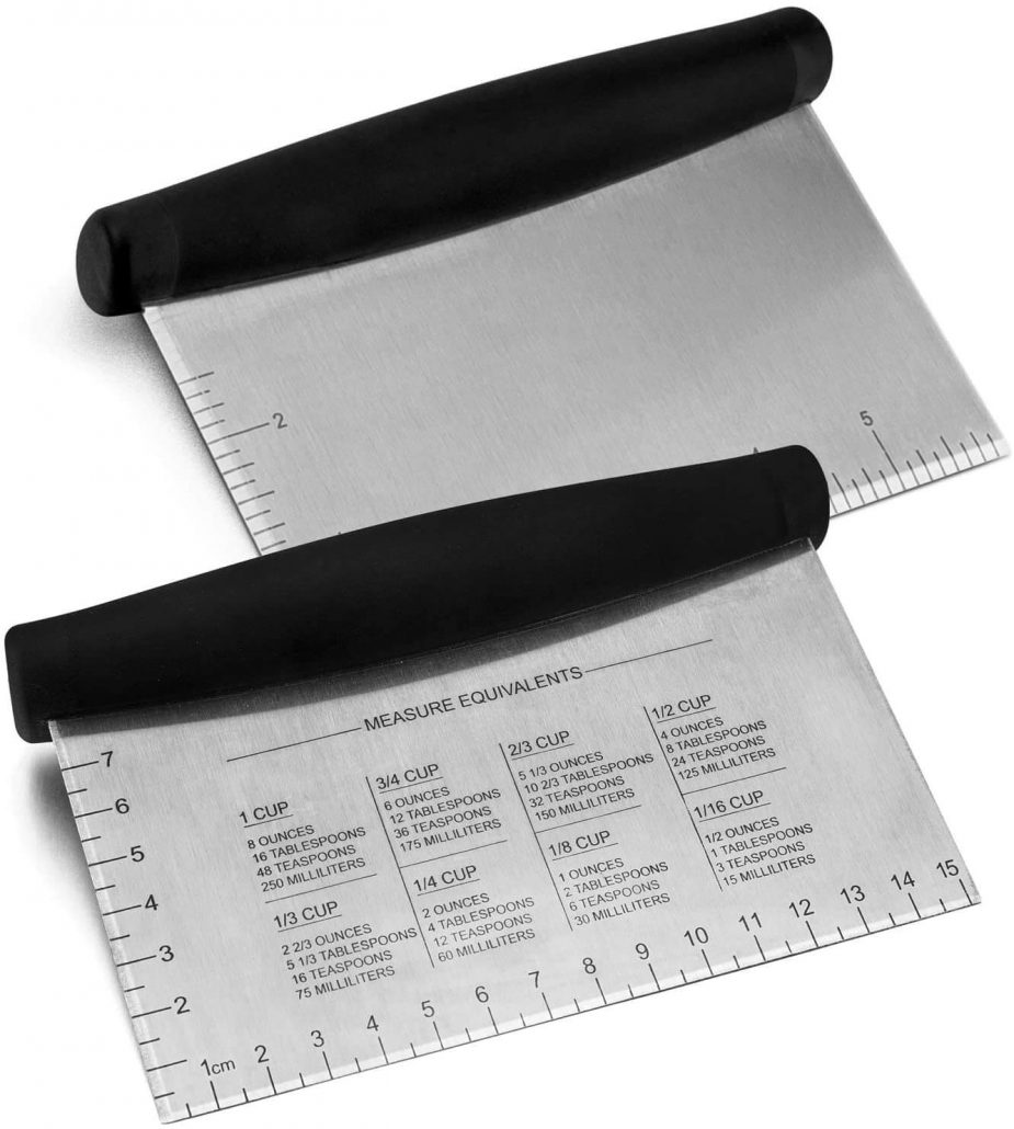 Stainless steel griddle scraper and food chopper with measuring guide.